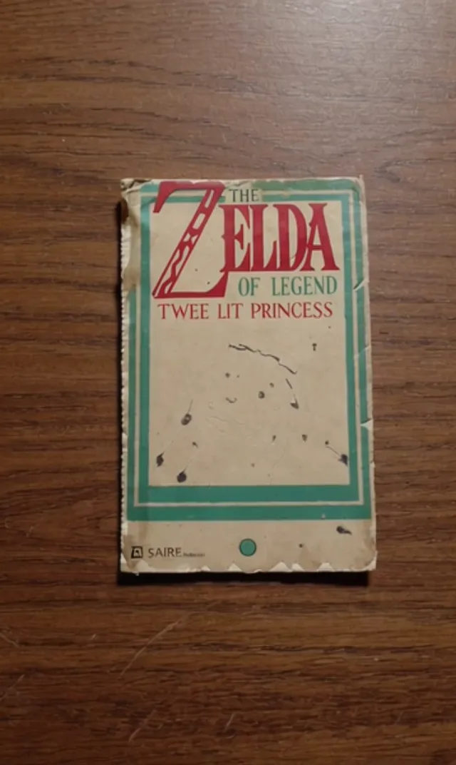 A worn parody game cartridge titled The Zelda of Legend: Twee Lit Princess